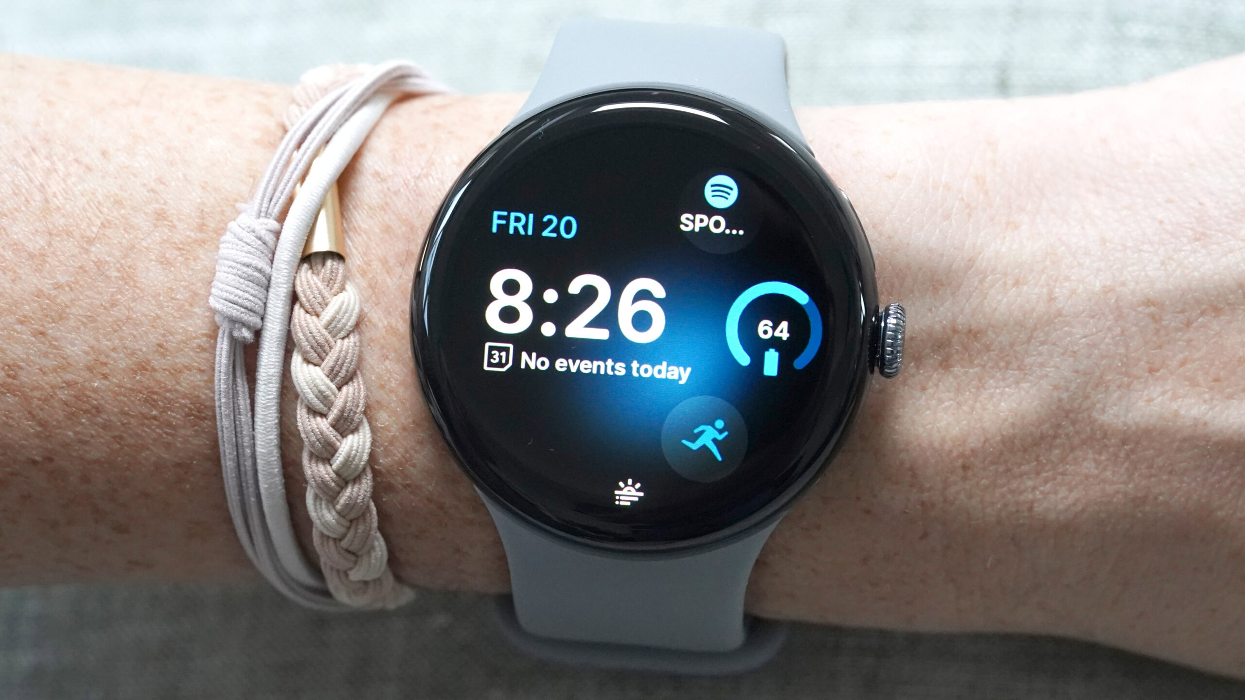 Google Pixel Watch 3 Morning Brief Notification A Google Pixel Watch 3 displays a watch face with a Morning Brief Notification at the bottom.